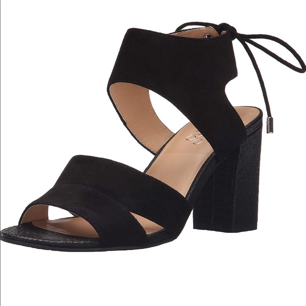 Tan and black block heel sandal with tie in back.